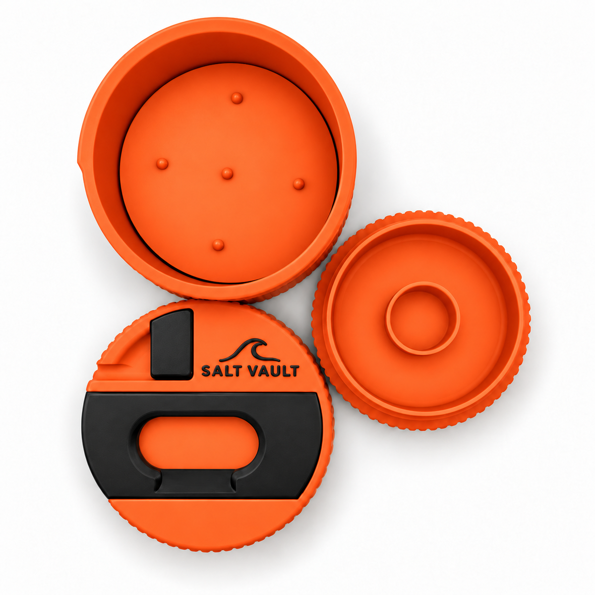 Salt Vault in Rescue Orange taken apart, top-down: the tub with its wax pusher plate, the lid with scraper, opener and fin key, and the base with its zinc compartment