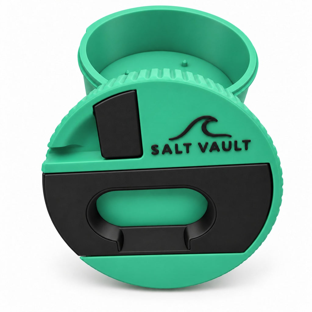 Salt Vault in Sea Green with the lid standing in front of the open tub
