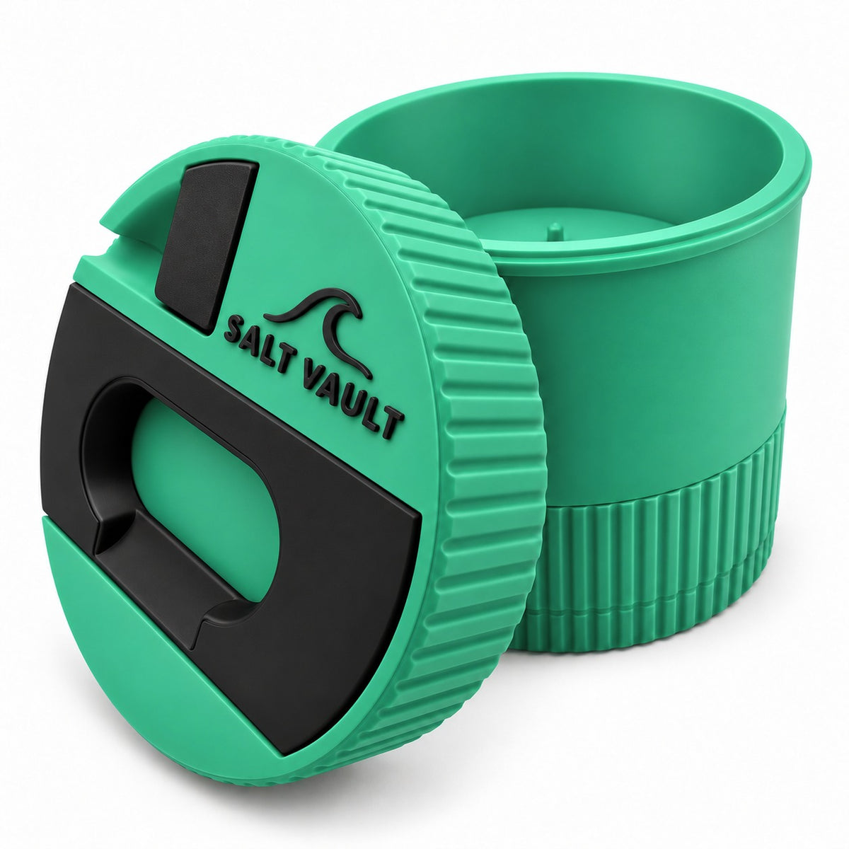 Salt Vault in Sea Green with the lid tilted beside the open tub, showing the ribbed grip edge and wind-up base